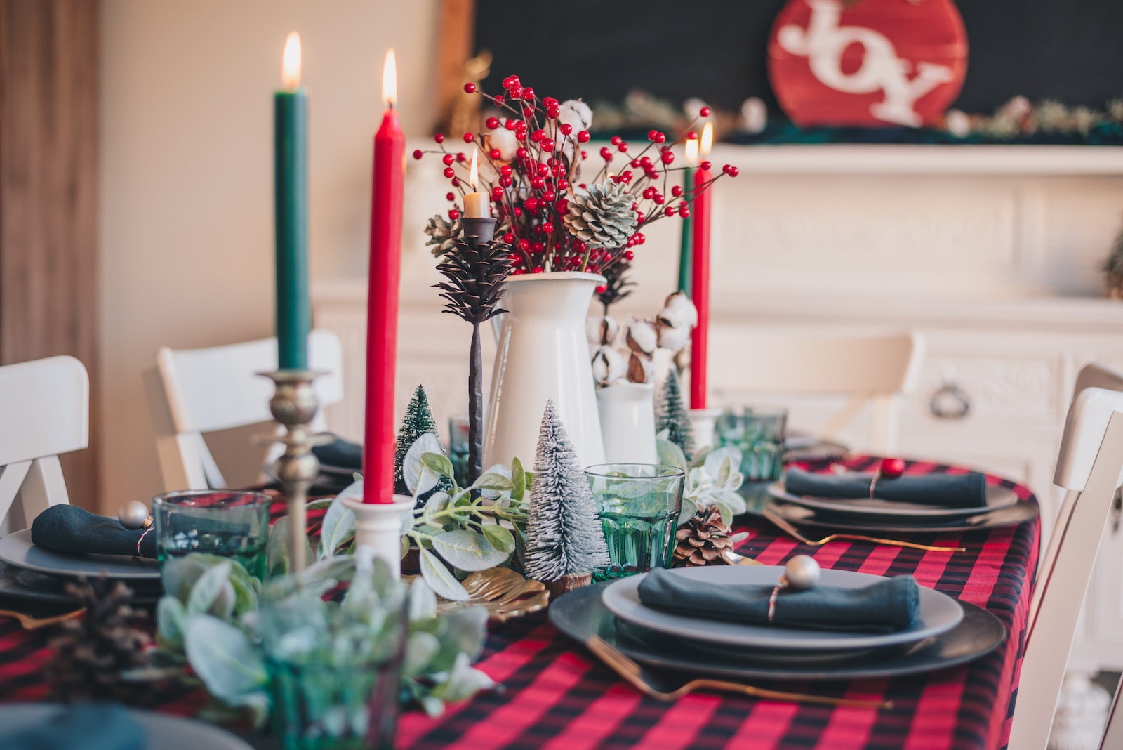 red and white candles on clear glass candle holder